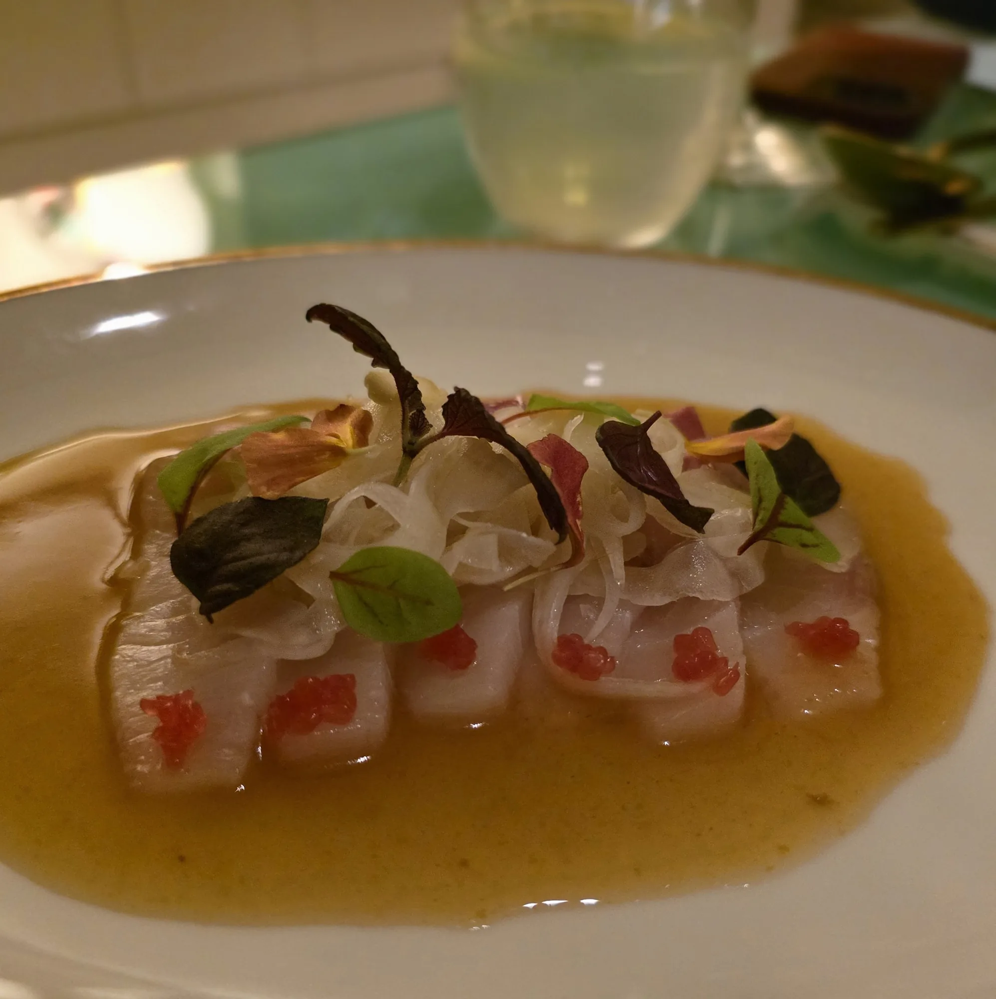 Raw Hiramasa kingfish, ginger, green chilli and finger lime.