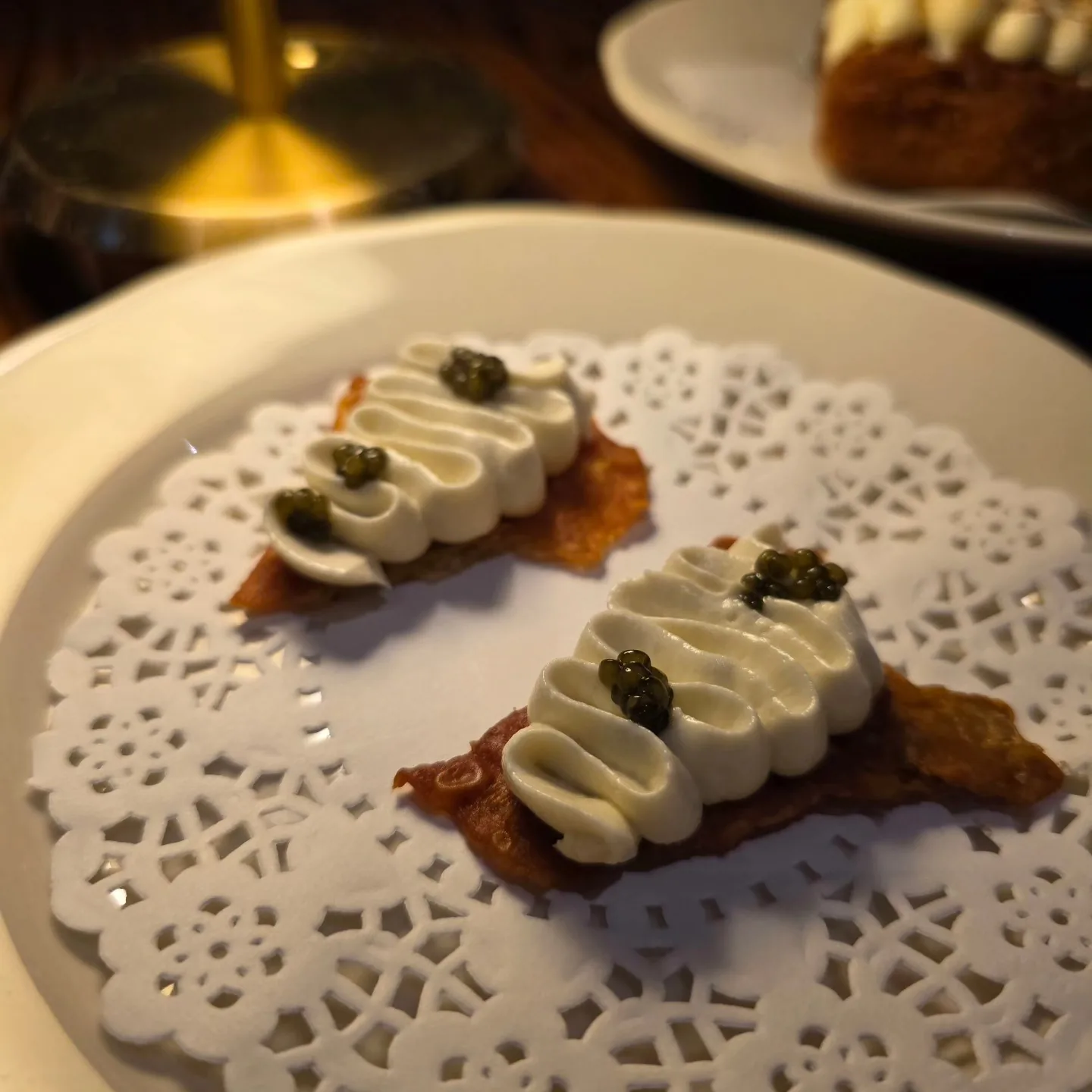 Chicken skin crisp, whipped cod roe, caviar.