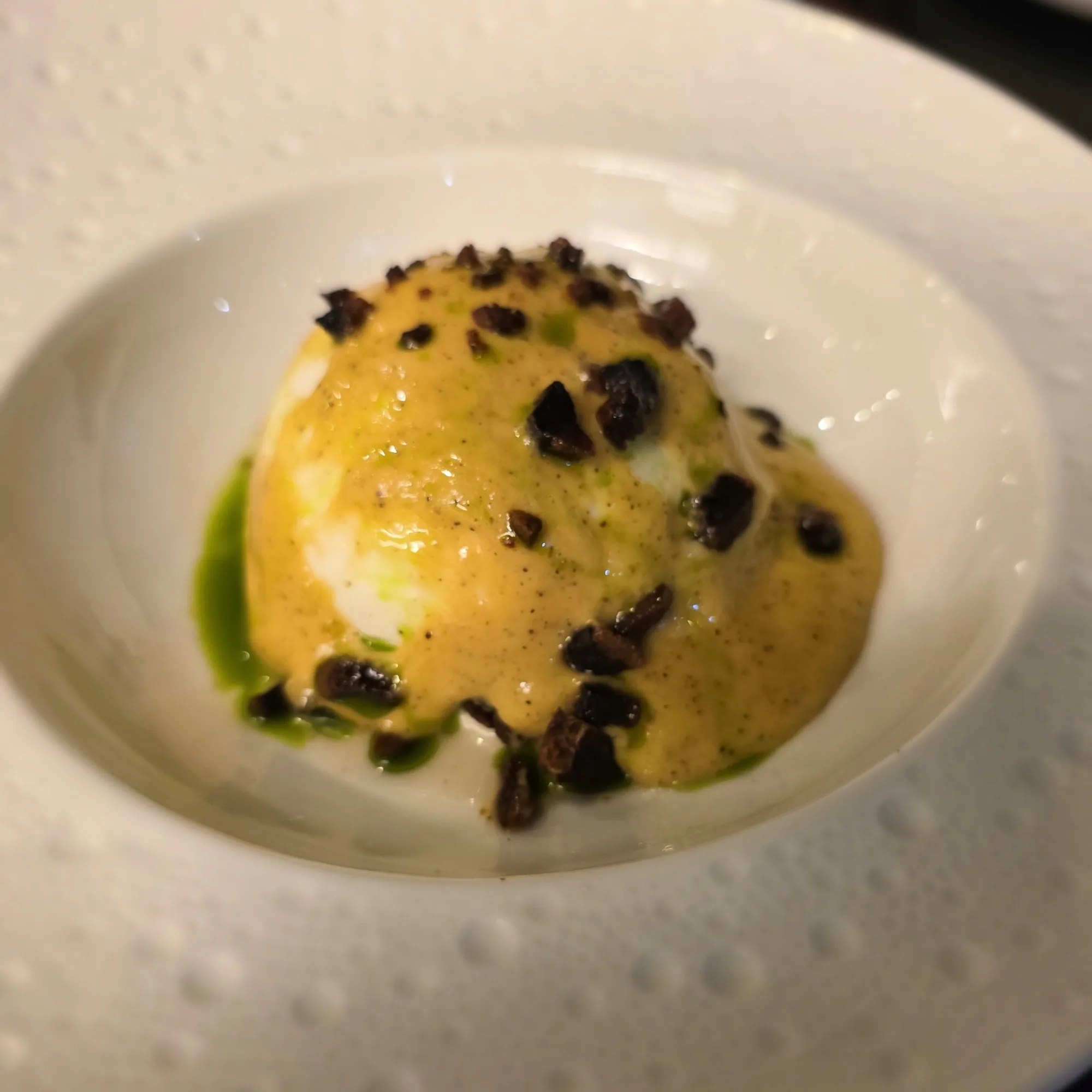 Carbonara burrata, burrata opera, carbonara foam, Pecorino Romano cream, crispy guanciale, black pepper, chive oil.