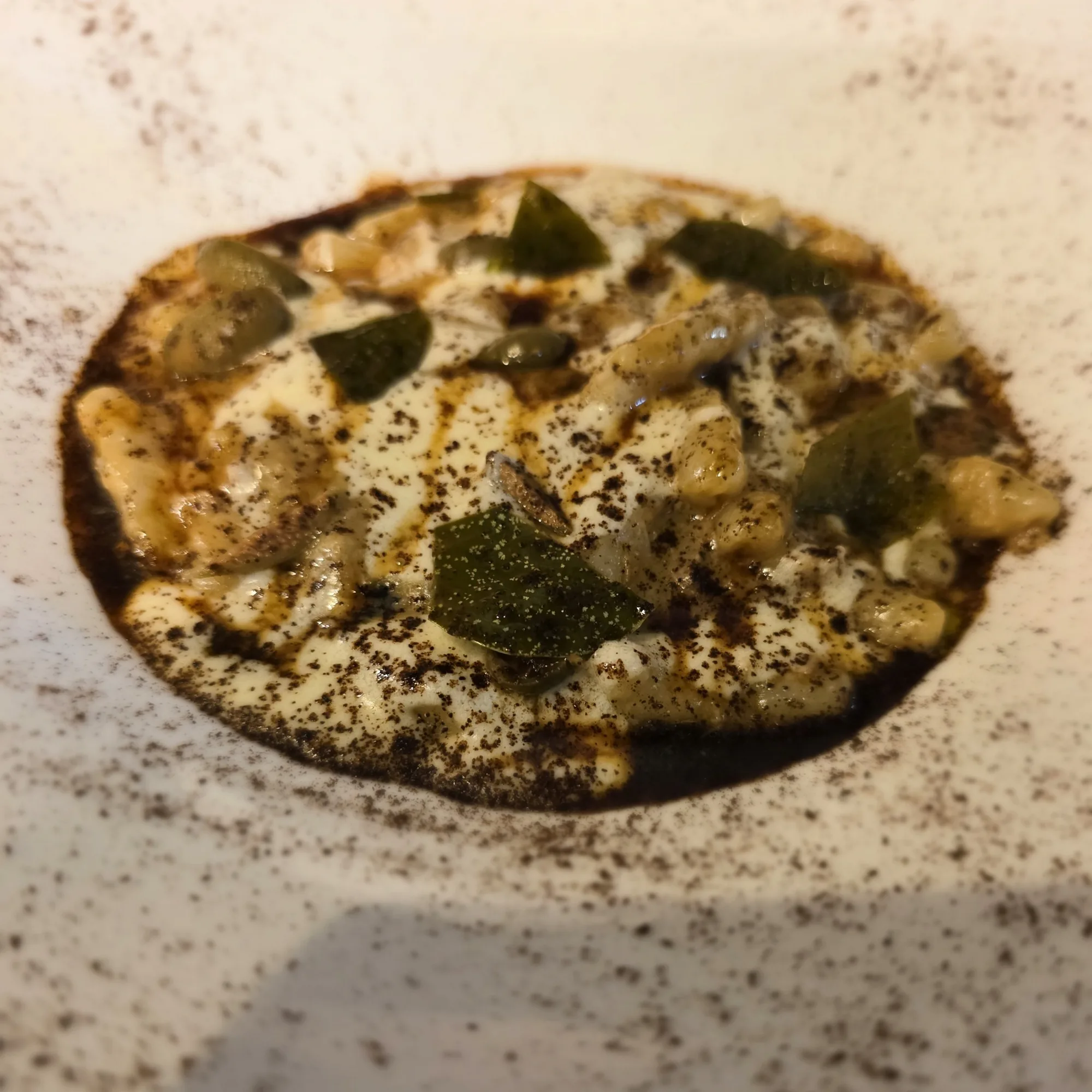 Game farm rabbit cavatelli, homemade semolina pasta, rabbit ragu, chestnut butter, goat cheese cream, caper leaves, coffee jus.