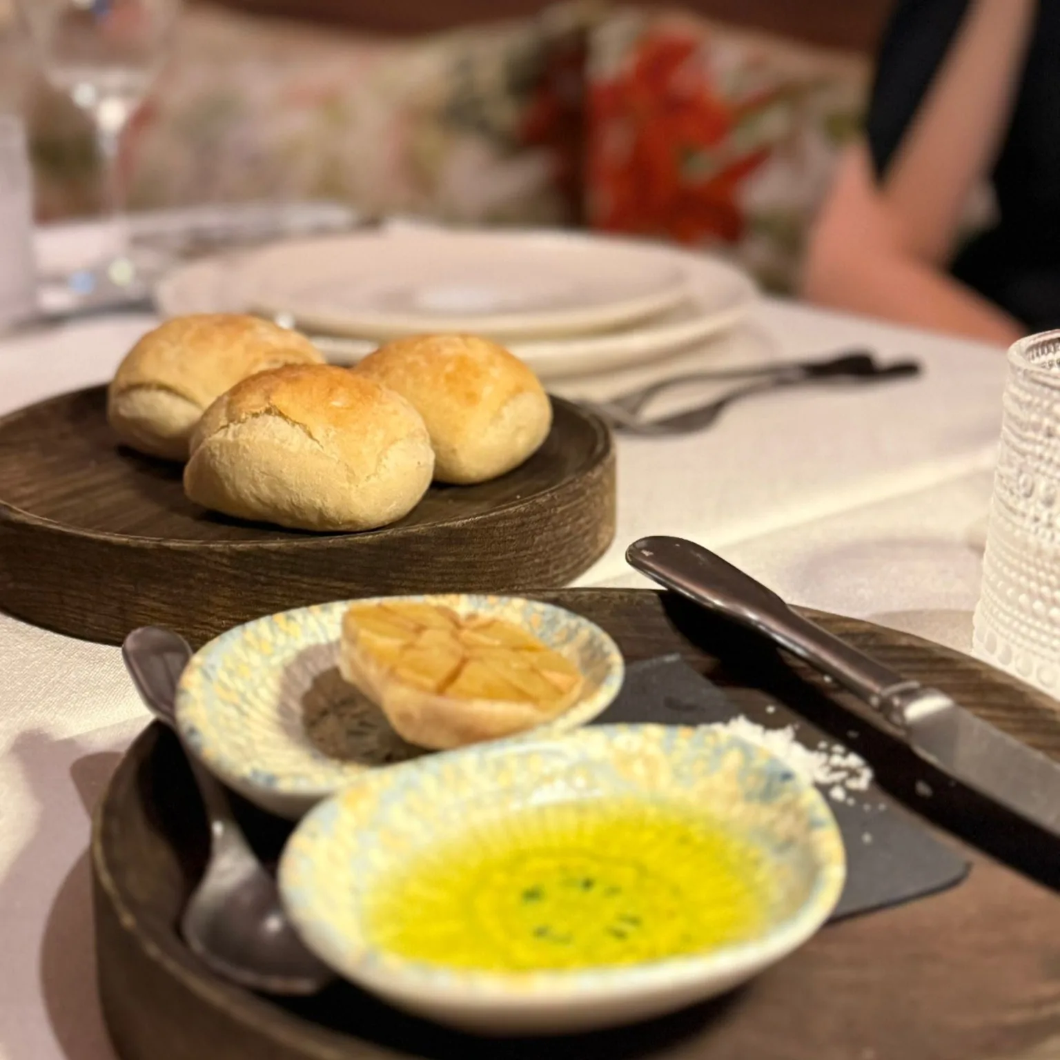 Warm sourdough rolls with roast garlic and extra virgin olive oil