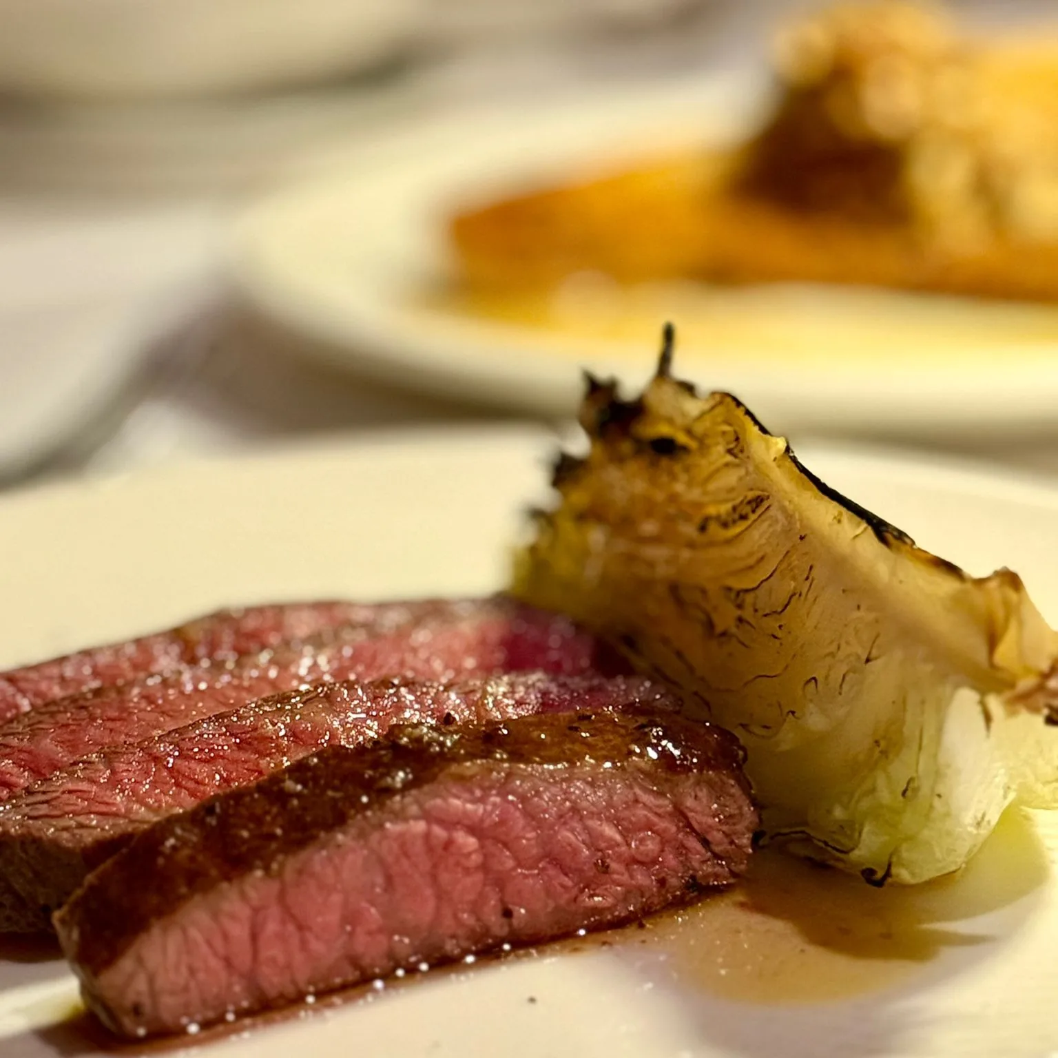 Jack’s Creek 180-day grain-fed black angus flat iron MBS+  with charred savoy cabbage