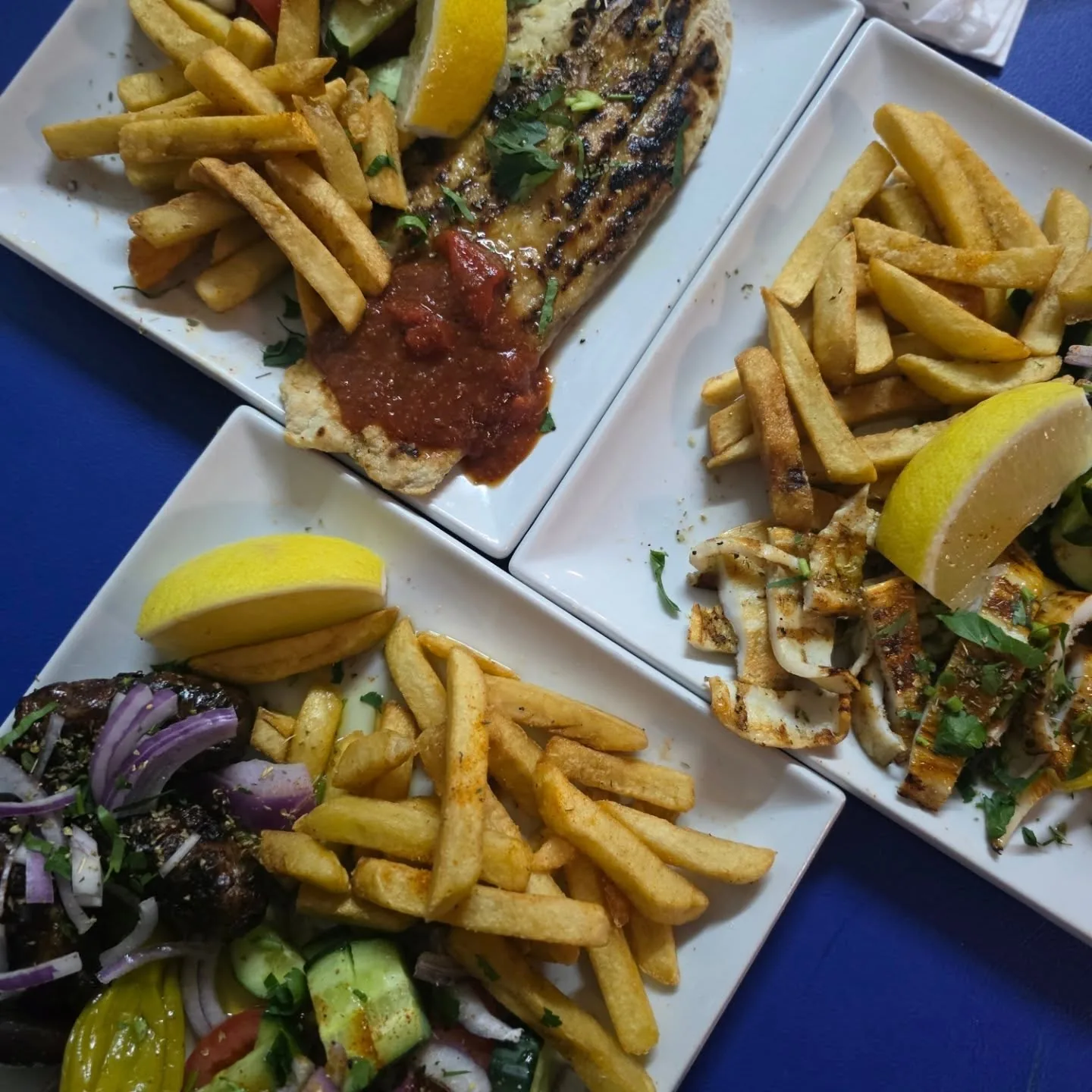 Piato barramundi, calamari and sheftalia