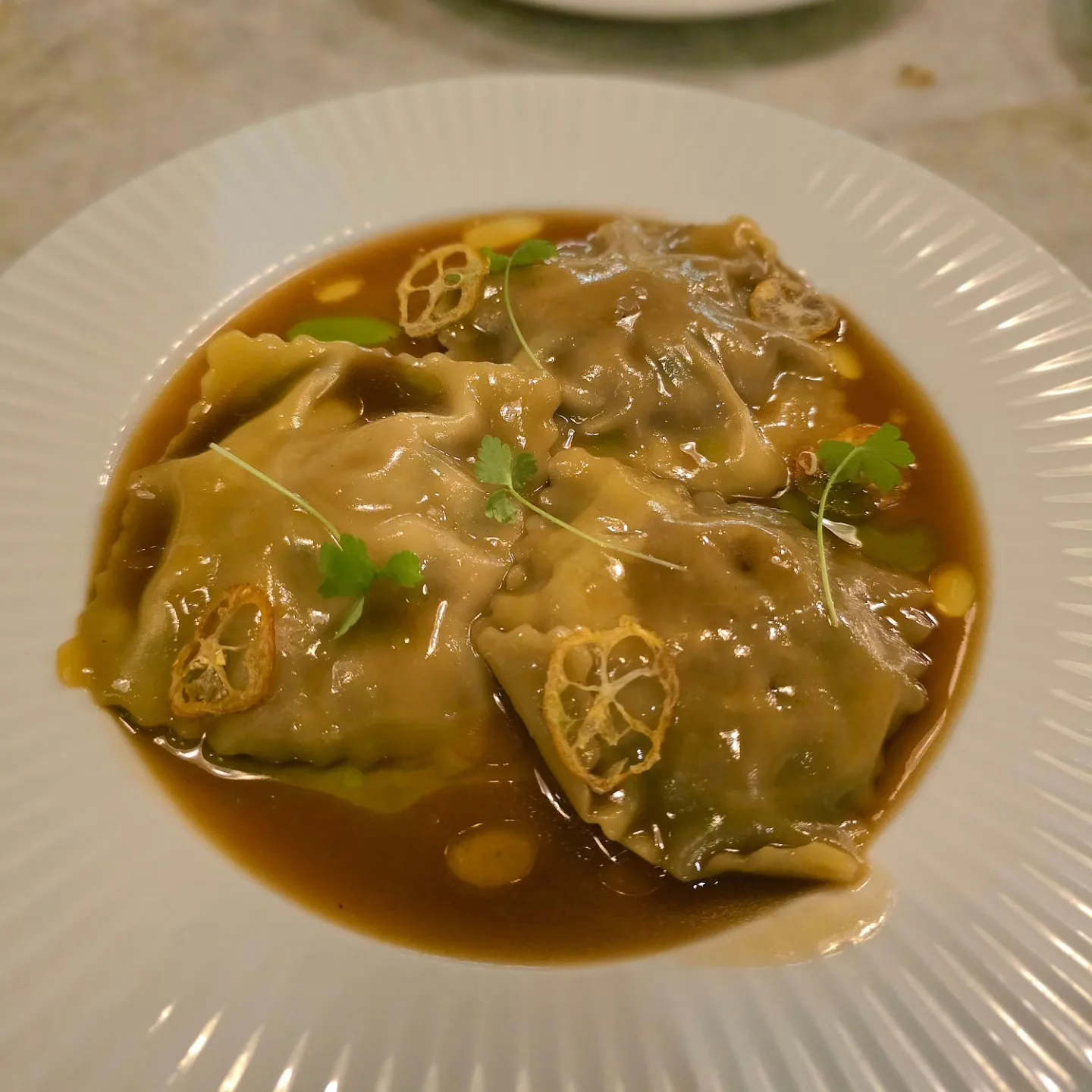 Ravioli Filled w Confit Duck in a Duck & Porcini Jus