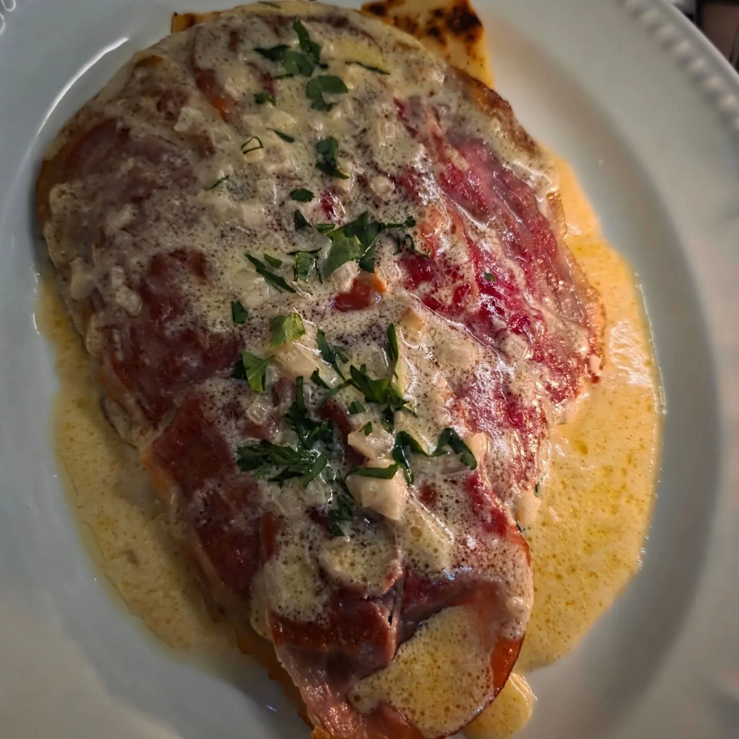 Veal saltimbocca with semolina gnocchi, spinach and white wine sauce