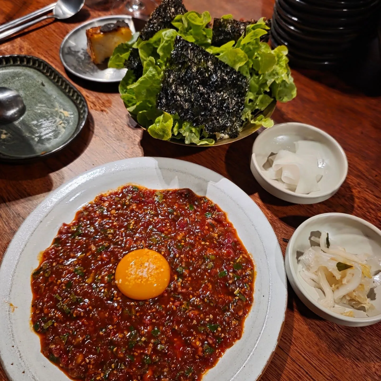 Yukhoe beef tartare, gochujang, yolk, sesame