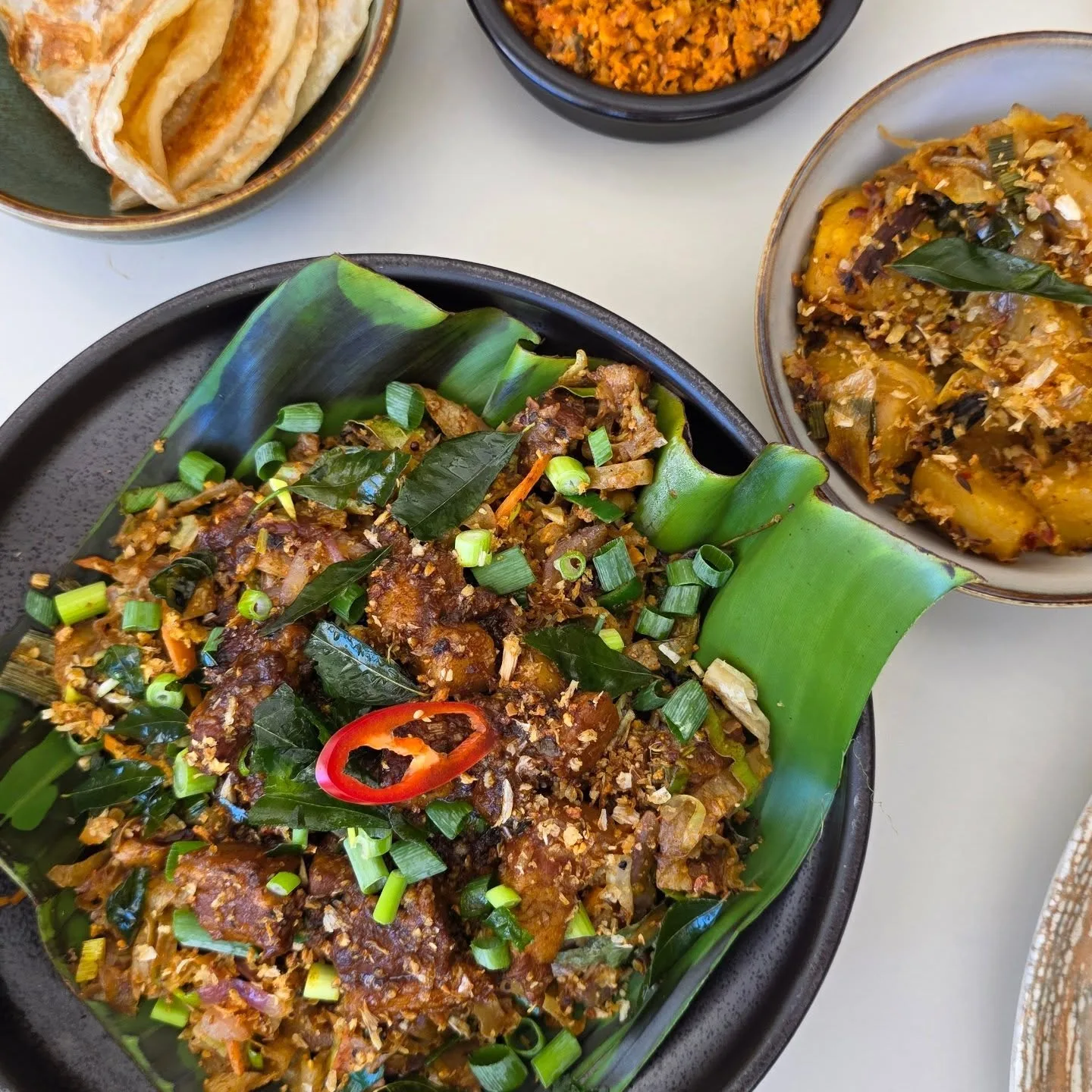 Black pork curry kottu