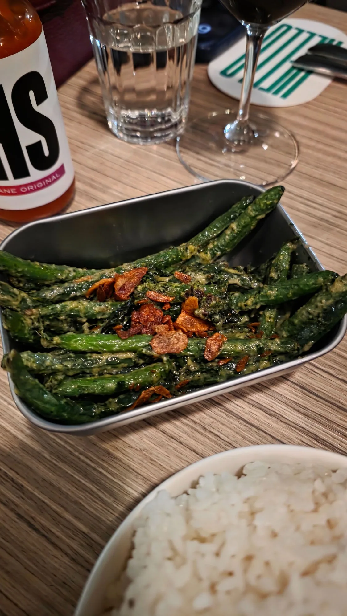 Wok fried green beans, sesame miso verde, crispy garlic