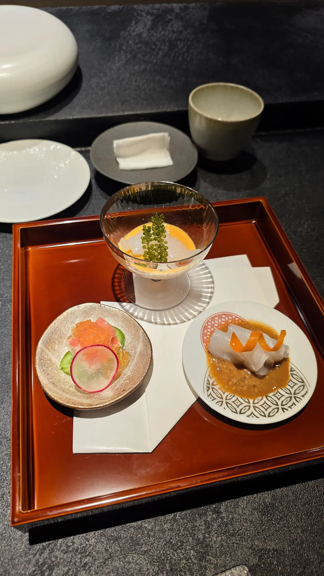 Hassun: sumi ika with uni sauce and sea grapes, Canadian snow crab in enzyme jelly, NSW sujiara sashimi with sesame shoyu