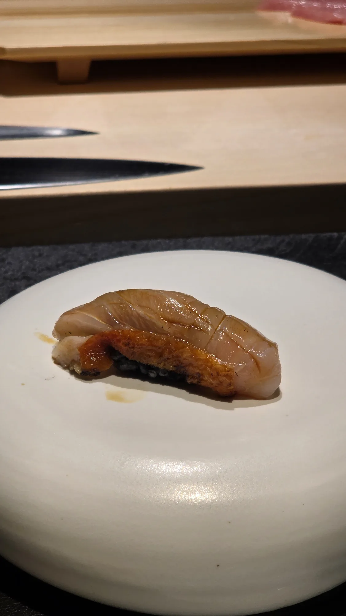 Straw-smoked kinmedai nigiri